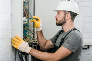 electrician performing electrical panel replacement