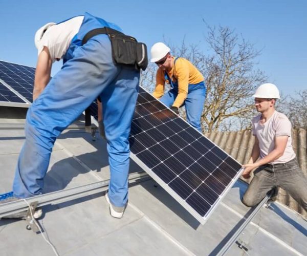 Electrician-laying-solar-panel (1)